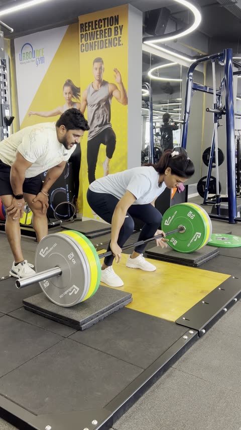 A client learning the deadlift