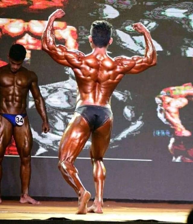 Back double biceps on stage