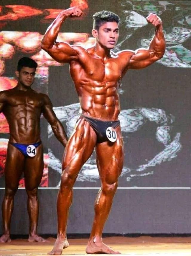Front double biceps on stage